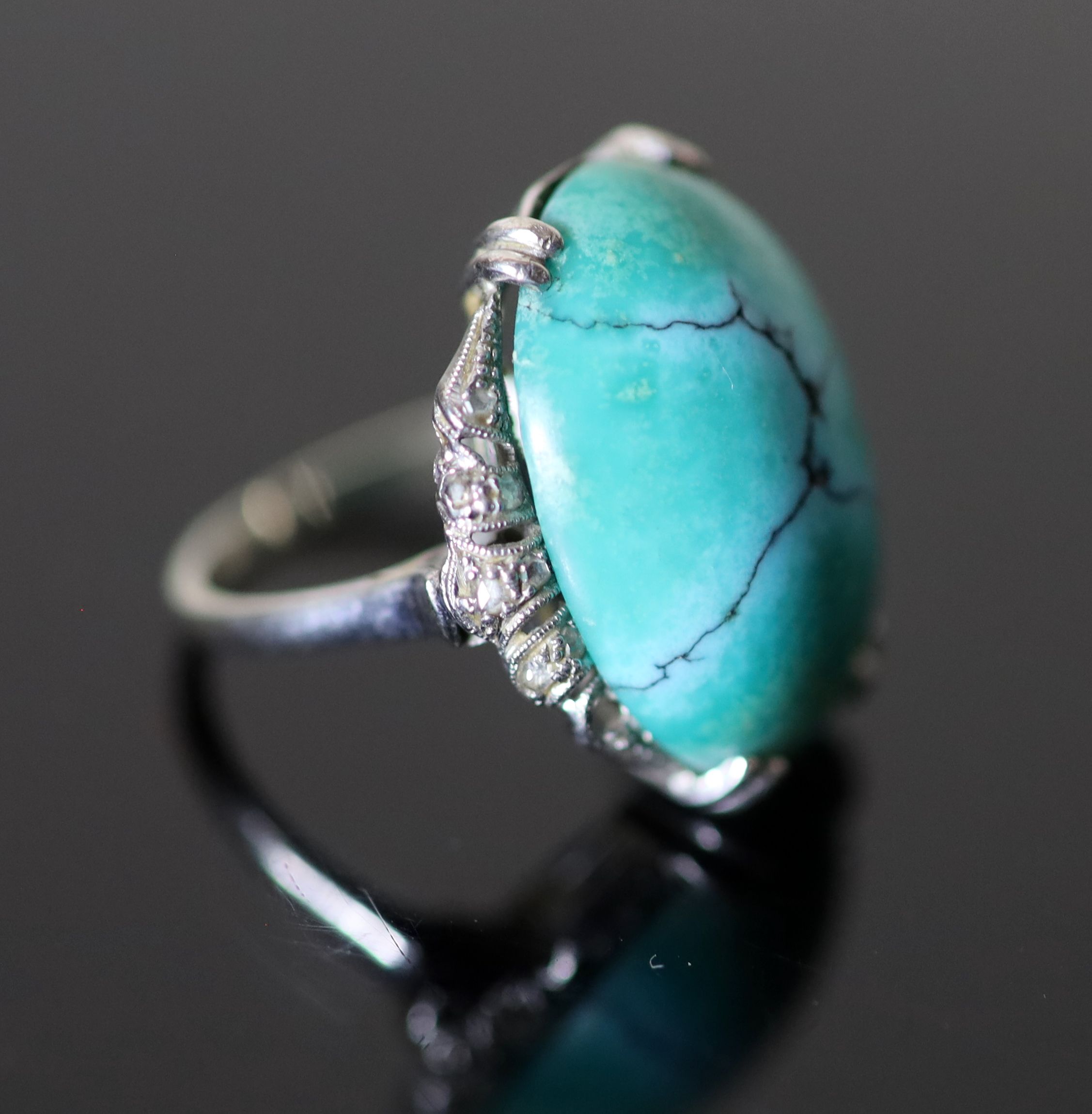 A 20th century 18k white gold, cabochon turquoise and rose cut diamond chip set oval dress ring,